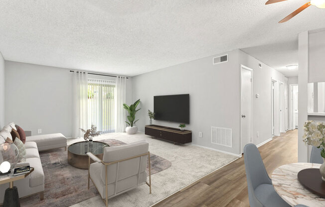 Living Room with a Couch and a TV at Lakes Edge Apartments, Greensboro, North Carolina