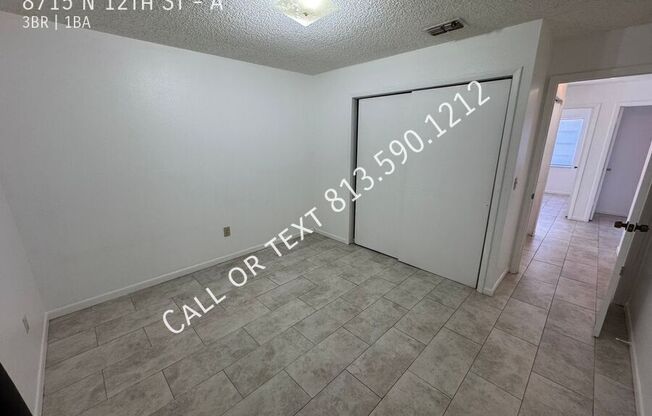 8715 N 12 ST
