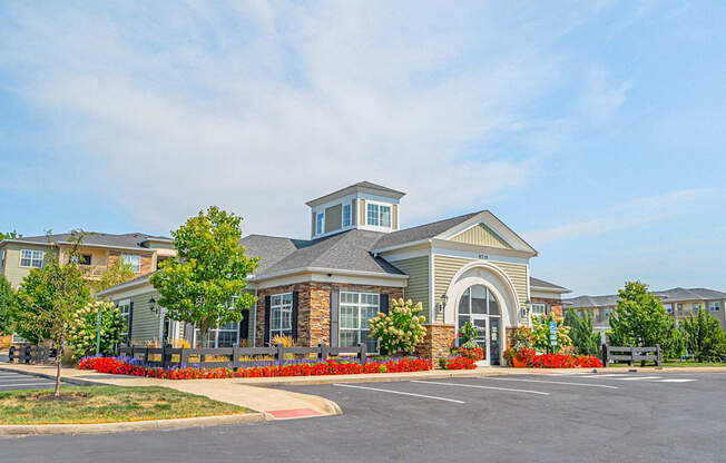 an exterior view of a building with a parking lot