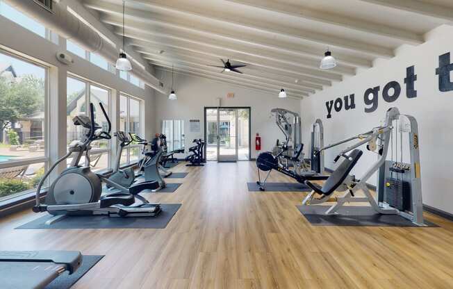a gym with cardio equipment and a sign that says you got to go