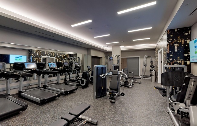 Club-quality fitness studio including cardio equipment with individual TV’s