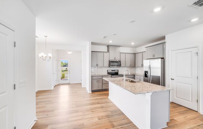 Brand-New End Unit Townhome in Riverstone – Designer Finishes & Future Resort-Style Amenities