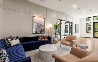 a living room with couches and chairs and a table