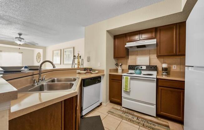 a kitchen with a stove and a sink