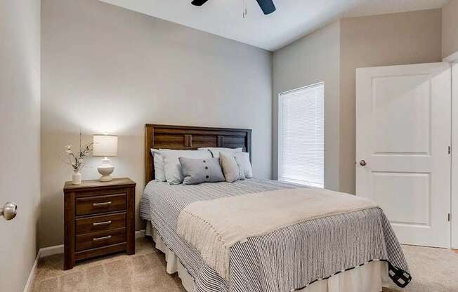 a bedroom with a bed and a closet. Circle Pines, MN Lexington Lofts