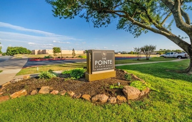Apartment entrance sign and landscaping