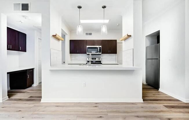 Spacious Kitchen with Breakfast Bar and Built In Workspace