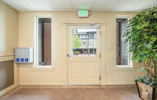 the entrance of a building with a door and a window