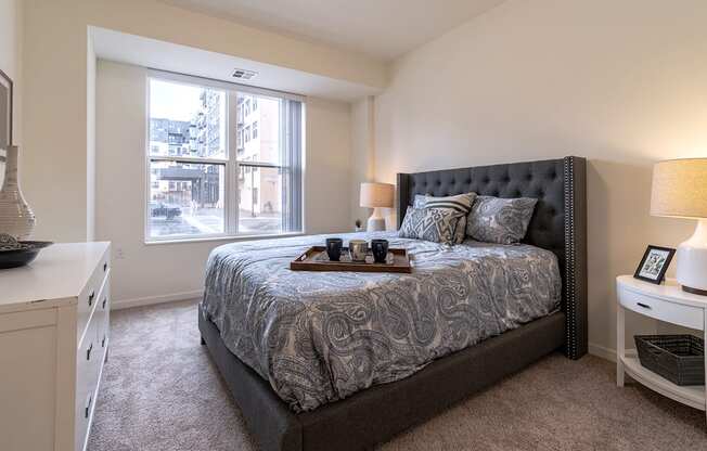 Dominium_Bren Road Station_-Bedroom with bed and lights at Bren Road Station 55+ Apartments, Minnetonka, 55343