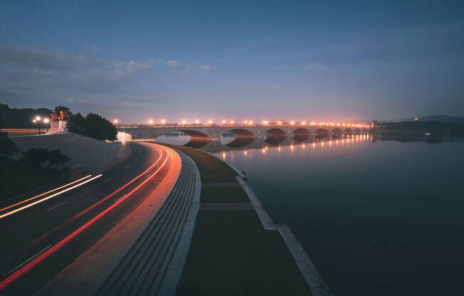 a bridge over a body of water at night