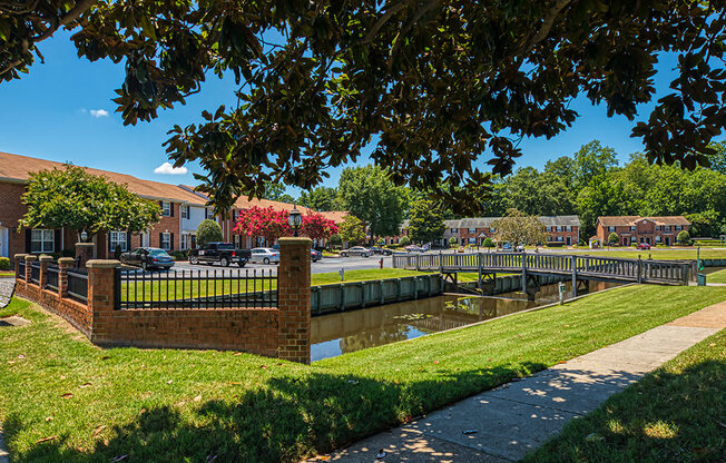 path, fence and canal at Holly Point Apartments