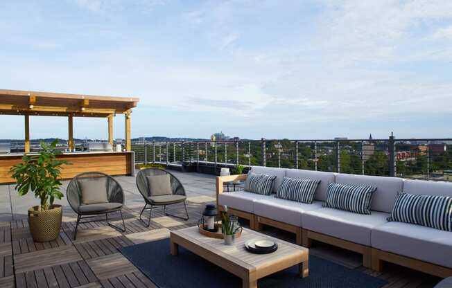 a rendering of a balcony with a couch and chairs at The Audubon New Haven, Connecticut