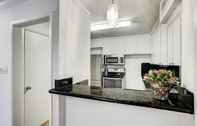 Beautifully remodeled two-story condo in a gated, centrally located community.