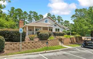 A house with a parking lot in front of it.