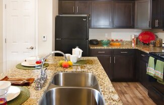 Modern Kitchen with Granite Countertops and Upgraded Black Appliances r at Talavera at the Junction Apartments & Townhomes, Utah, 84047