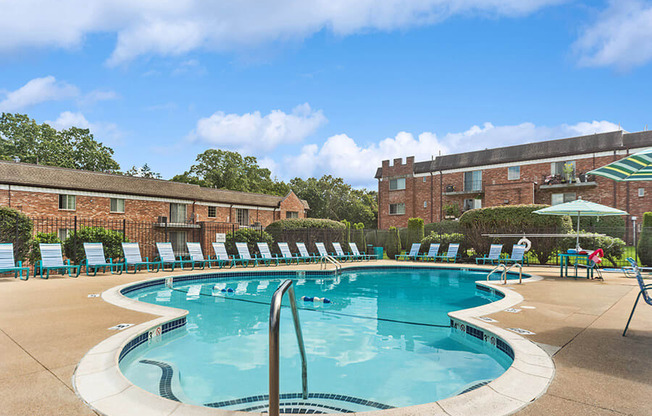Community Swimming Pool with Pool Furniture at Heights Marlborough Apartments in Boston, MA.