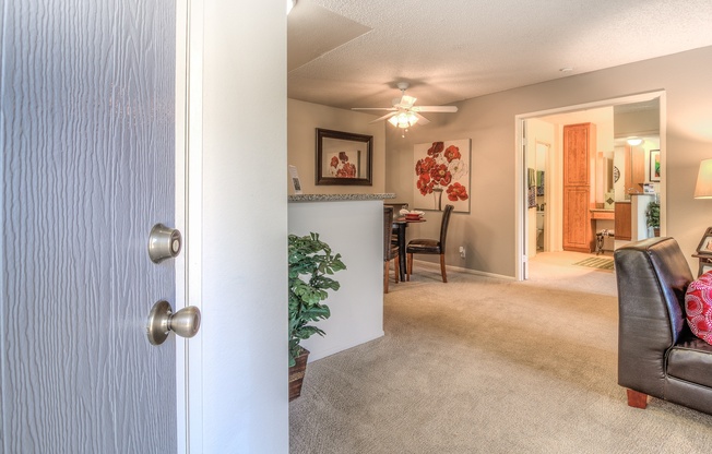 A living room with a couch and a chair.