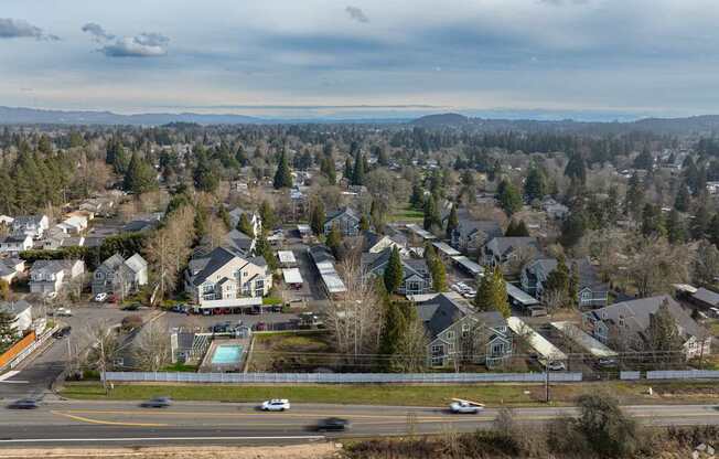 A suburban neighborhood with houses and a road.