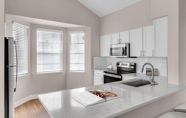 Kitchen with breakfast bar at The Links at Plum Creek in Castle Rock, CO