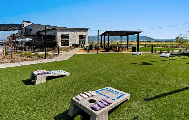 a park with benches and a building in the background