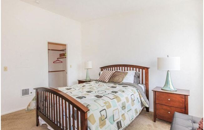 a bedroom with a bed and two night stands at Riverview Springs, Oceanside