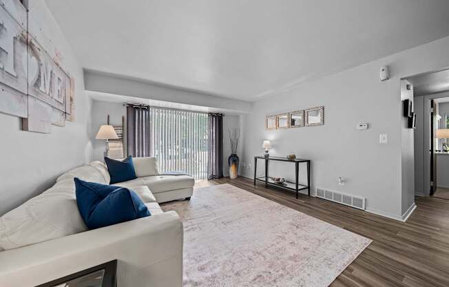 Spacious living room with natural light at Westwood Village Apartments in Westland, MI