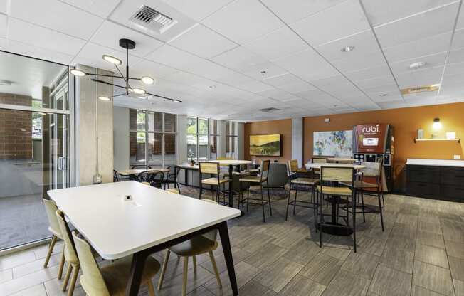 Resident seating area with tables and chairs at Sedona Apartments, Washington, 98115