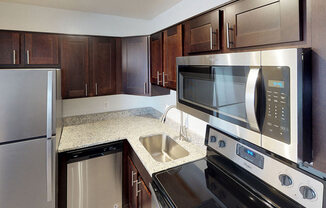 Modern stainless steel appliances at Woodlee Terrace Apartments, Woodbridge, VA