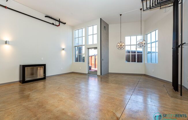 SoMa: Luxurious Remodeled Conversion Live/Work Loft w/ Private Patio, W/D in unit & Garage Parking