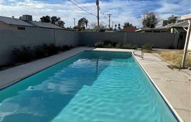 Spacious 4-Bed Home with Pool & Fireplace in 89102!