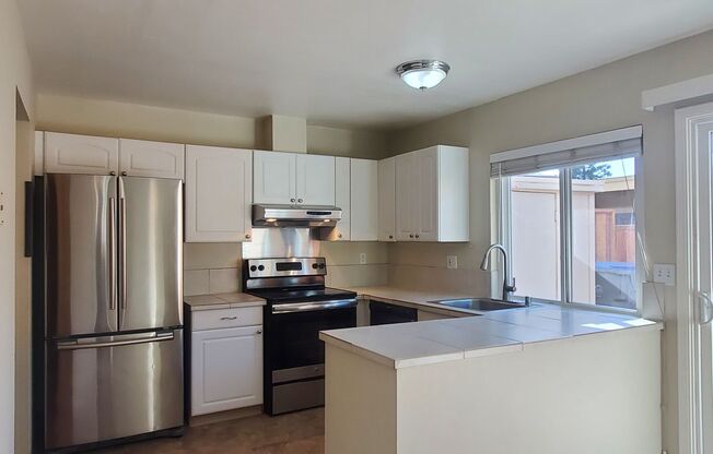 Spacious 2-Story Townhome, A/C, Remodeled Bathrooms, Fresh Paint, Patio, 2C Parking, Great Location!