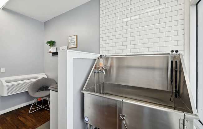 a kitchen with a stainless steel counter top and a sink
