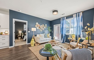 a living room with blue walls and a white couch