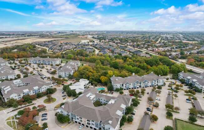 an aerial view of a neighborhood with houses and trees