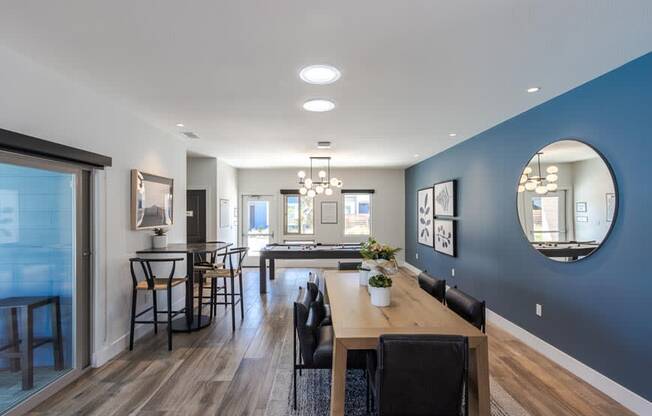 a dining room and living room with a table and chairs