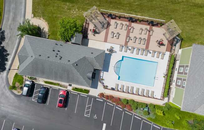 an aerial view of a house with a pool on the roof