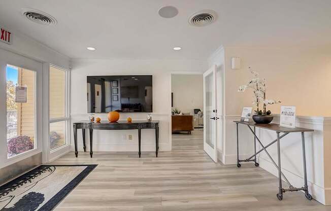 A reception area with a desk and a chair.