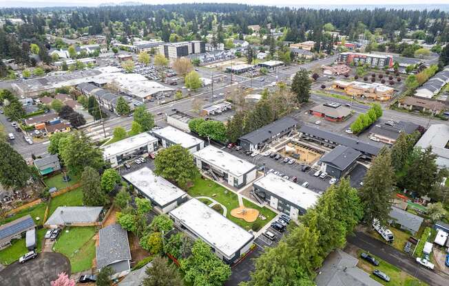 A bird's eye view of a small town with a mix of residential and commercial buildings.