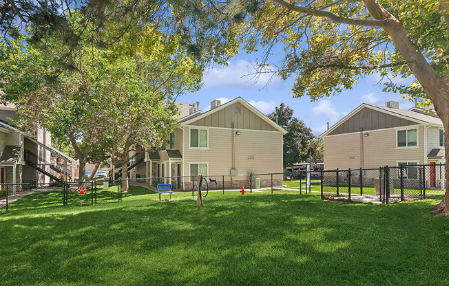 Community Dog Park with Agility Equipment at Broadmoor Village Apartments located in West Jordan, UT.