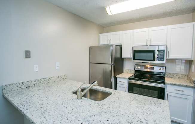 Kitchen with Stainless Steel Appliances at Best Apartments in Gwinnett County