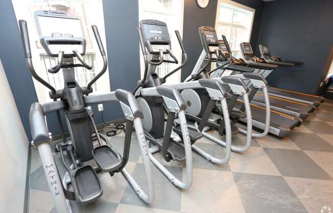 a row of exercise bikes in a gym at Century Baxter Avenue, Louisville Kentucky