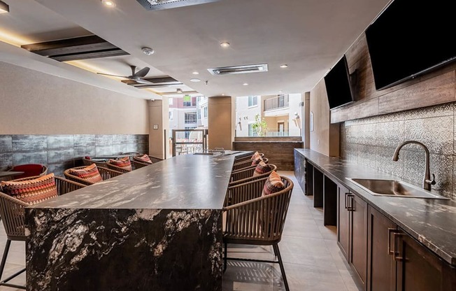 a large bar in a restaurant with chairs