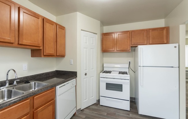 This is a photo of the kitchen of the 1004 square foot, 2 bedroom/1 bath Townhome with stackable washer/dryer floor plan at Colonial Ridge Apartments in the Pleasant Ridge neighborhood of Cincinnati, OH.