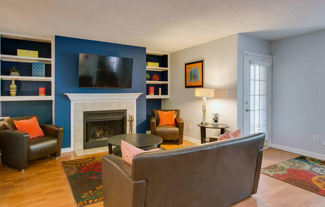 Resident Lounge with fireplace, seating, tv