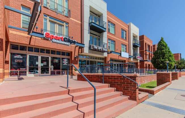 a large brick building with stairs in front of it