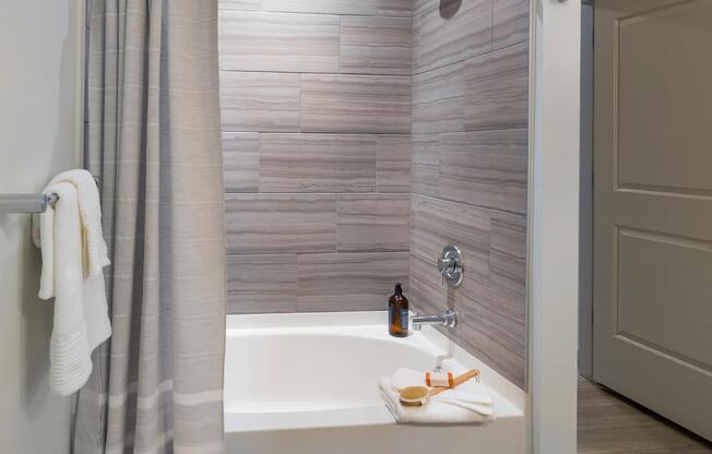 Oversized tub-shower in bathroom in apartment at Modera West Wash Park