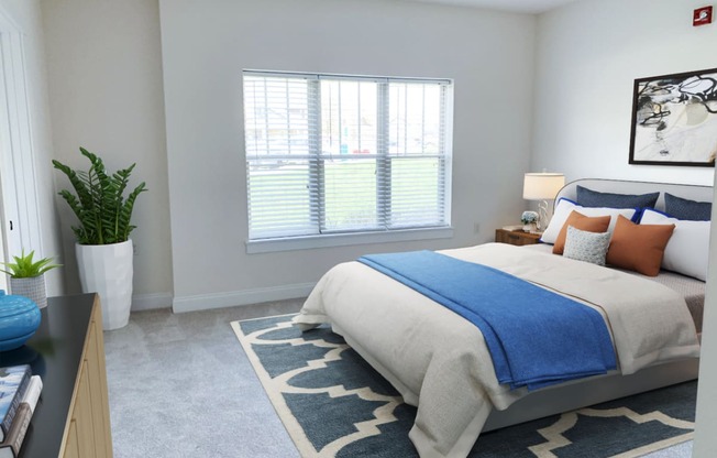 a bedroom with a bed and a potted plant