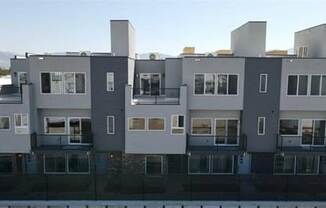 an exterior view of multiple townhomes