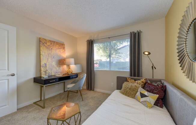 Bedroom with Large Window, Daybed, Carpet, Black Table and Window