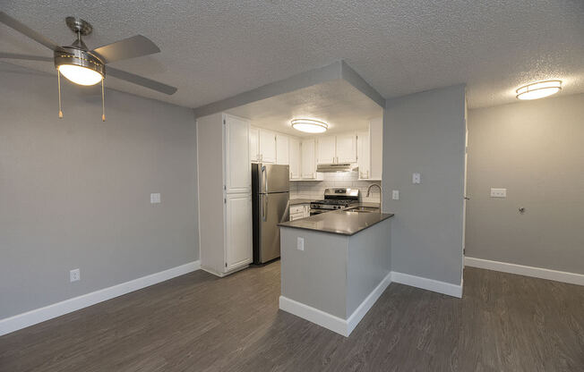 Living and dining area near kitchen l Vue at the Lake in Sacramento